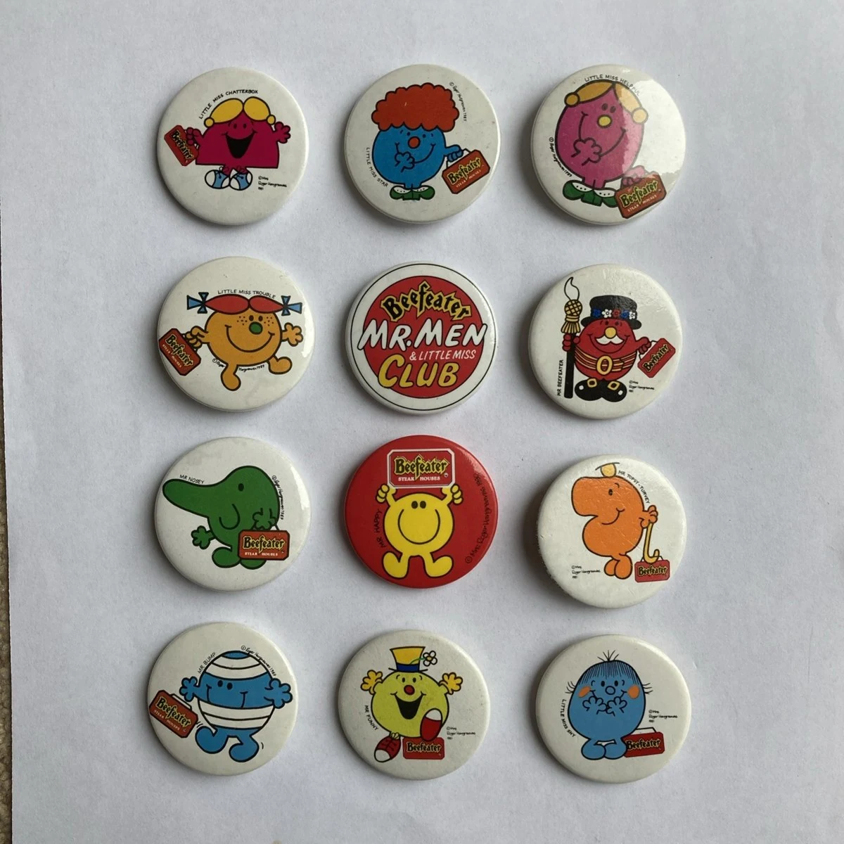 Twelve later Mr Men and Little Miss badges, including the Club badge