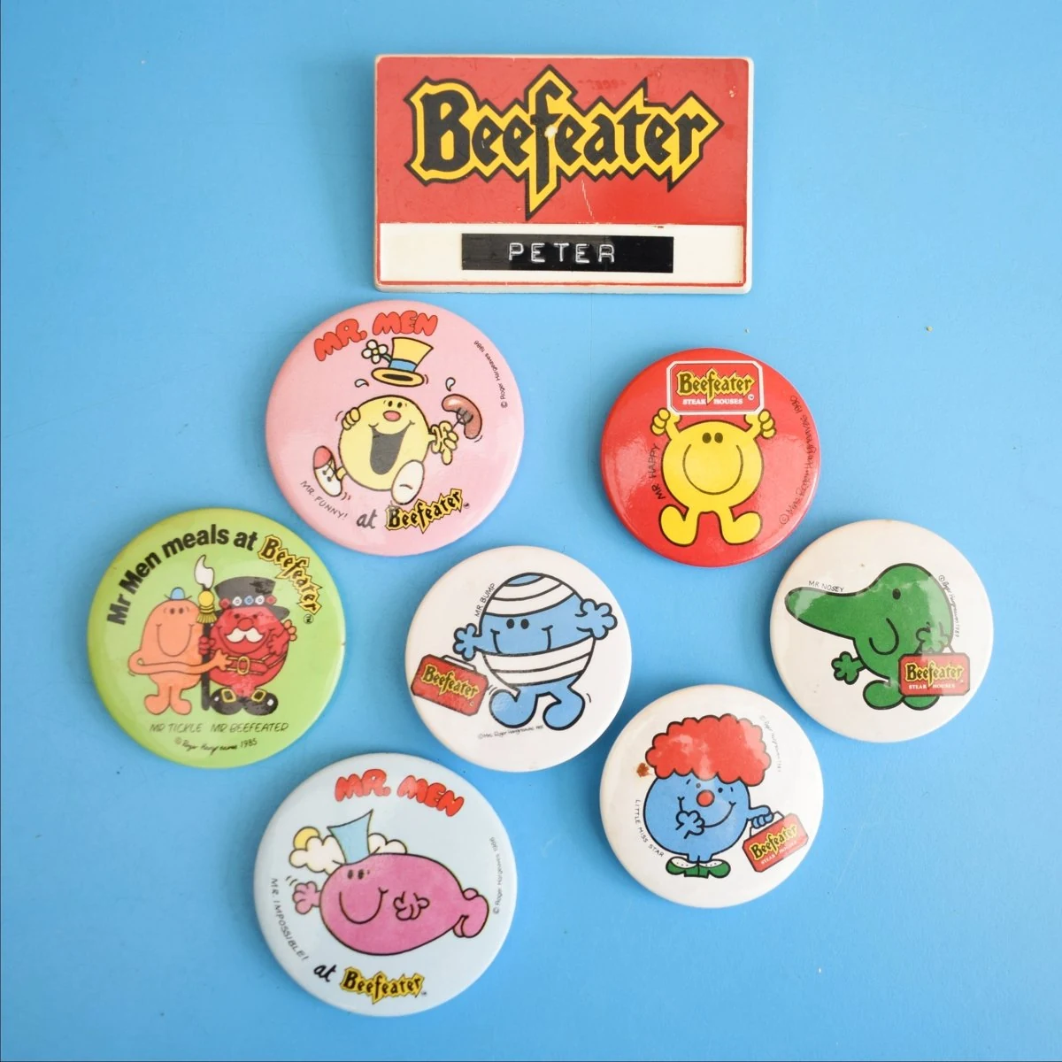 Mr Men Beefeater badges with a staff name badge