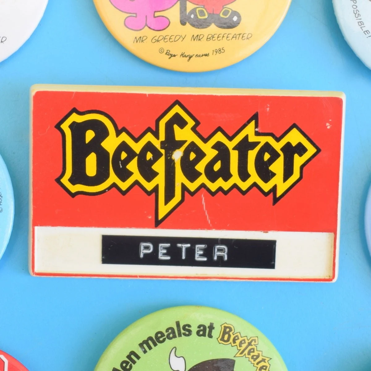 A Beefeater staff name badge